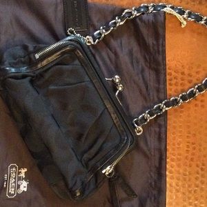 Nearly perfect coach pocketbook with silver trim.  Canvas with leather trim.